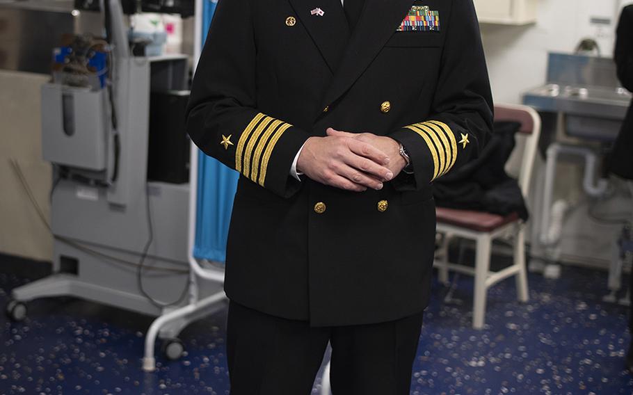 USS America commander Capt. Luke Frost speaks to reporters during a tour of the ship at Sasebo Naval Base, Japan, Friday, Dec. 6, 2019.