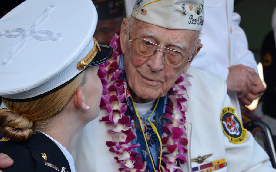 Don Long, who was stationed at Kaneohe Naval Air Station during the Japanese surprise attack, chats with a guest Dec. 7, 2019, at the Pearl Harbor National Memorial before a ceremony marking the attacks' 78th anniversary.