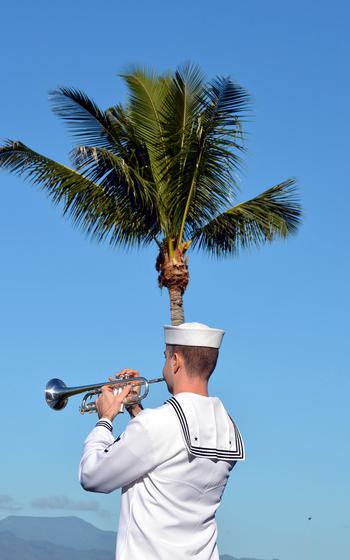 A sailor plays taps Dec. 7, 2019, to honor those who lost their lives during the Japanese surprise attack at Pearl Harbor 78 years ago.