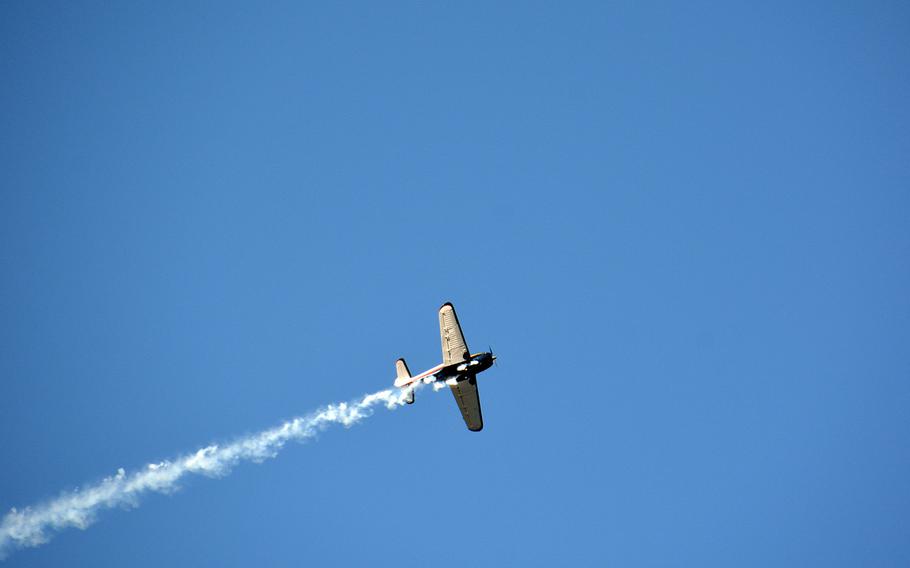 A vintage Globe Swift airplane does a flyover Dec. 7, 2019, at the Pearl Harbor National Memorial during a ceremony marking the 78th anniversary of the Japanese surprise attack on Oahu.