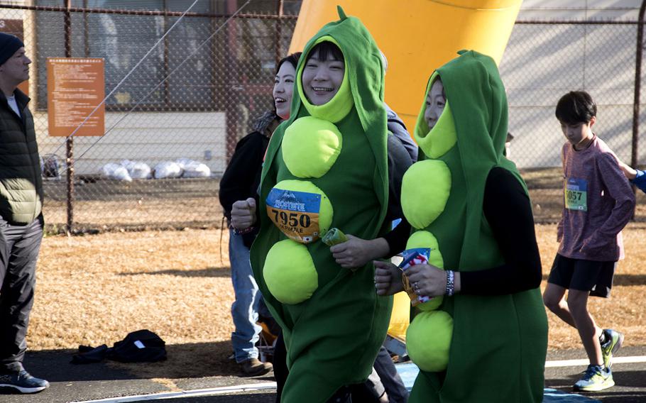 A pair of peapods participate in the 39th annual Yokota Striders Frostbite road race at Yokota Air Base, Japan, Sunday, Jan. 19, 2020.