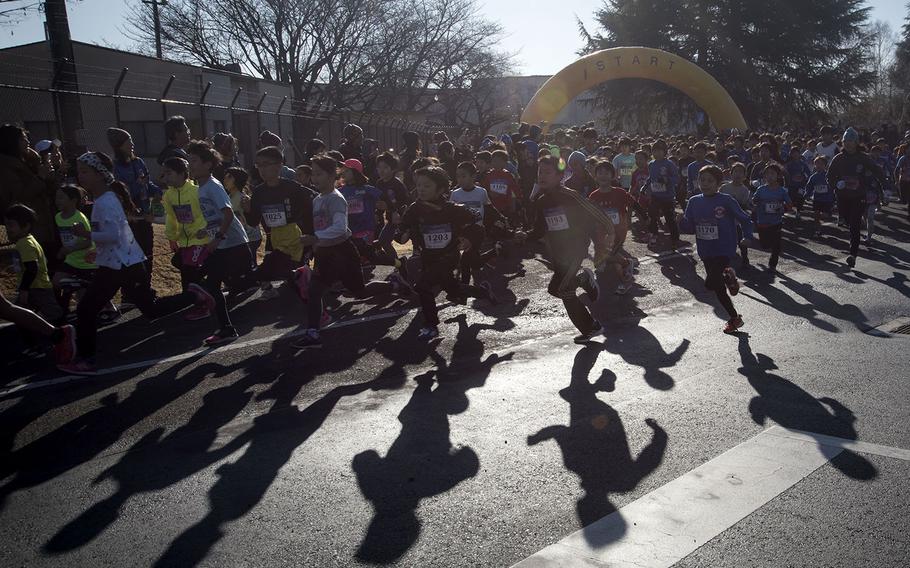 Young runners begin their event during the 39th annual Yokota Striders Frostbite road race at Yokota Air Base, Japan, Sunday, Jan. 19, 2020. 