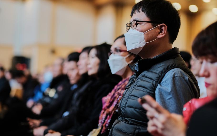 People listen during a town hall meeting about a possible furlough for South Korean base workers at Camp Humphreys, South Korea, Wednesday, Jan. 29, 2020. 