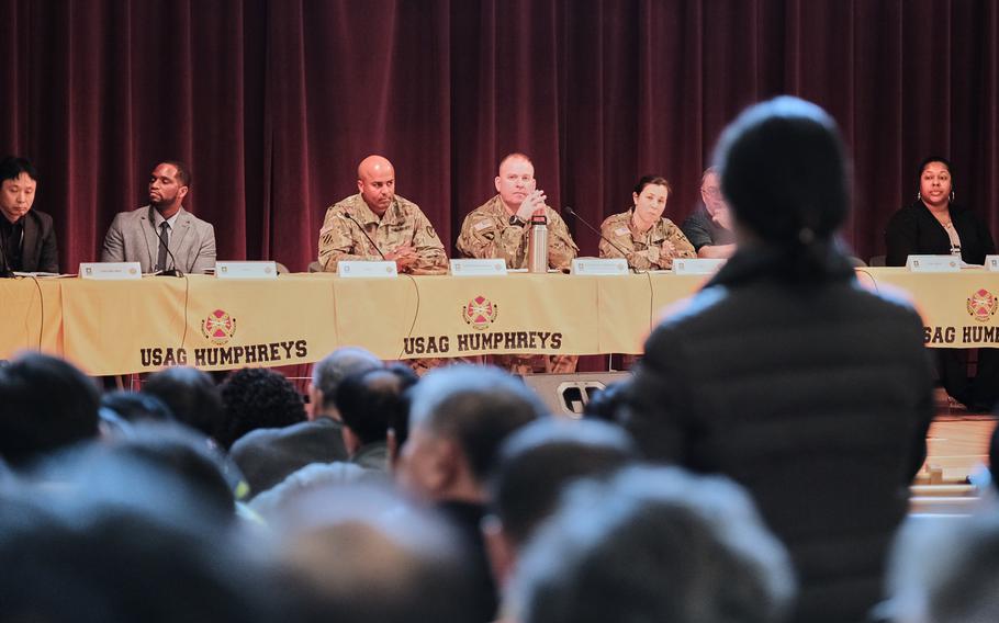 A woman asks a question during a town hall meeting about a possible furlough for South Korean workers at Camp Humphreys, South Korea, Wednesday, Jan. 29, 2020.
