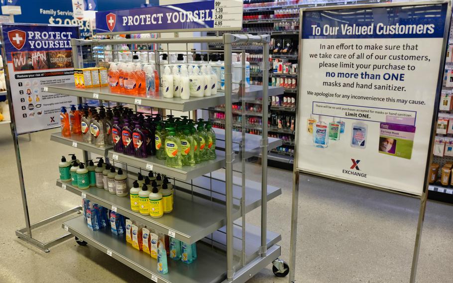 A sign encourages customers to purchase no more than one of various antibacterial soaps and cleaners on the shelf at the Post Exchange at Camp Humphreys, South Korea, Monday, Feb. 24, 2020.



