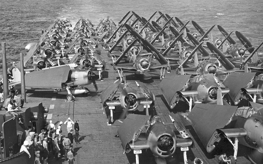 U.S. Avengers, Hellcats, and SBD Dauntless aircraft stand aboard the USS Intrepid carrier in 1944. 