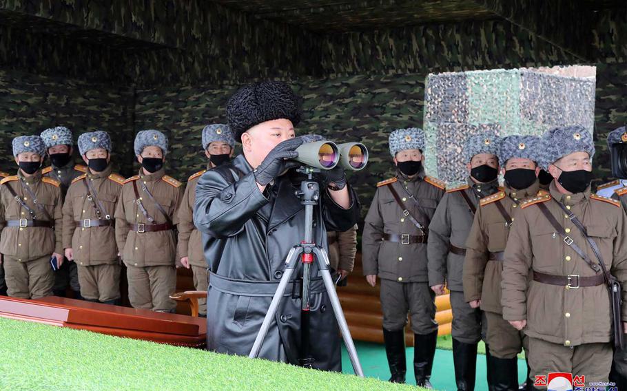 North Korean leader Kim Jong Un, center, inspects the military drill of units of the Korean People's Army, with soldiers shown wearing face masks in this Friday, Feb. 28, 2020, file photo provided on Feb. 29, 2020 by the North Korean government.