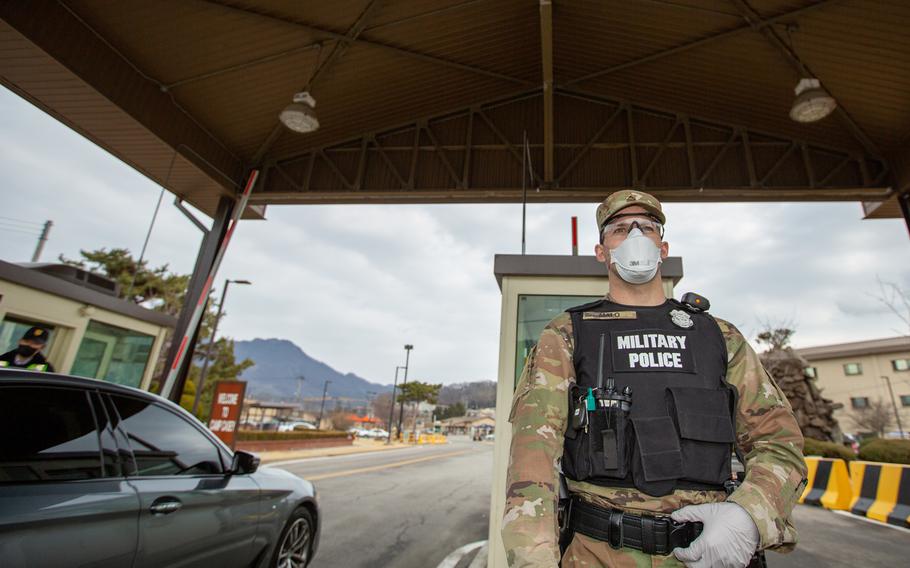 Soldiers stationed on U.S. Army Garrison Casey conduct pre-screening processes on individuals awaiting entry to the base, USAG-Casey, Dongducheon, Republic of Korea, Feb. 26, 2020.