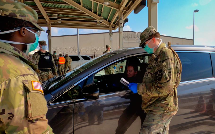Soldiers from the 2nd Infantry Division conduct checks at a gate to Camp Humphreys, Feb. 27, 2020.