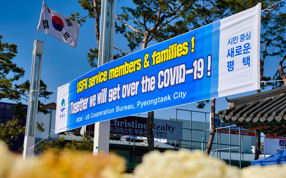 Banners promoting coronavirus cooperation between the U.S. and South Korea are displayed outside Camp Humphreys on Monday, Mar. 16, 2020.
