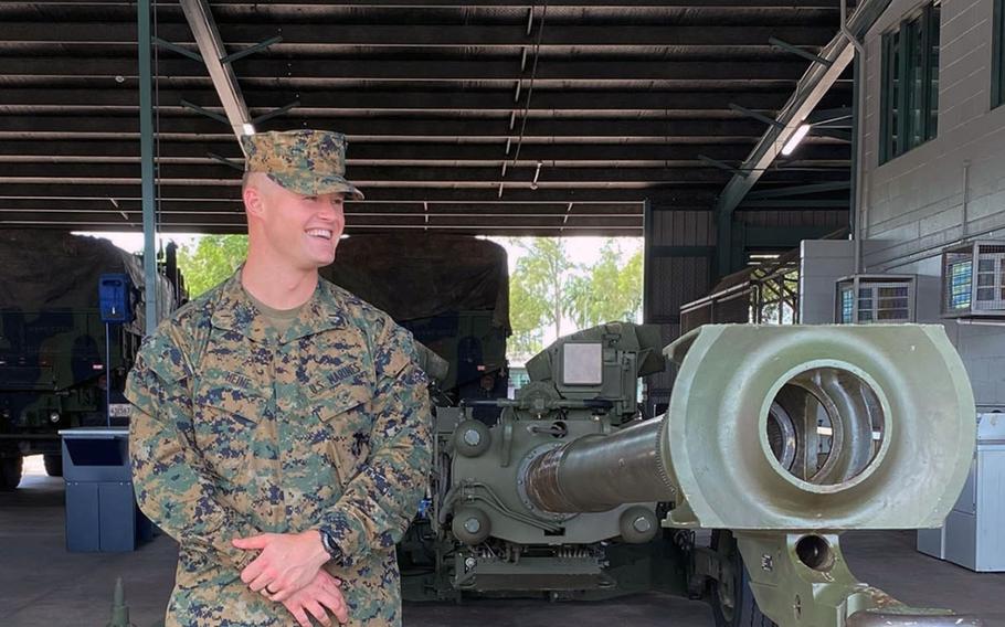Marine 1st Lt. Kevin Heine of 3rd Battalion, 11th Marine Regiment, stands with an M777 howitzer in Darwin, Australia, after completing a mandatory 14-day self-quarantine on Wednesday, April 8, 2020.