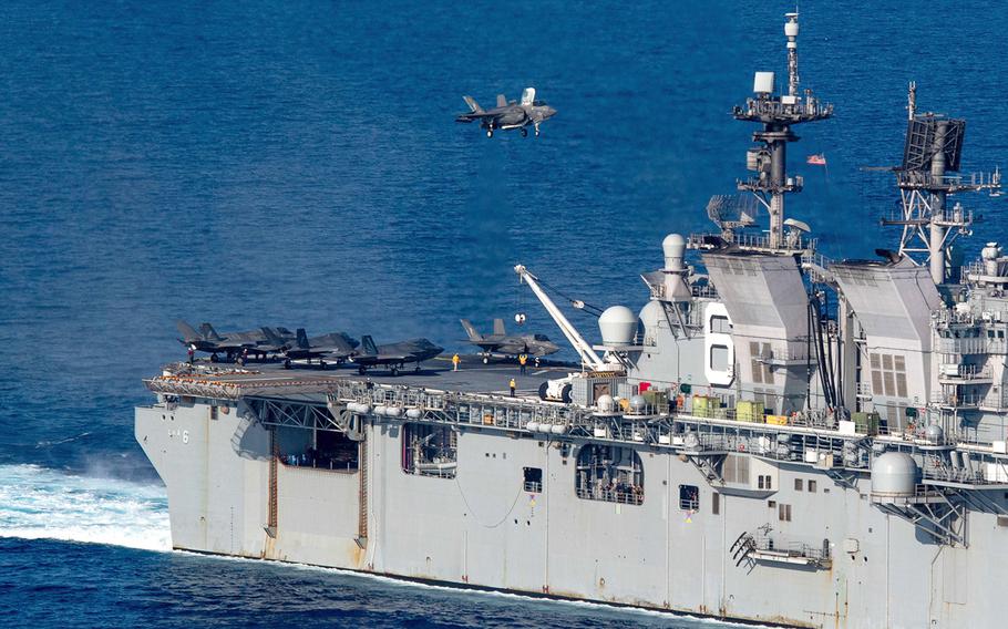 A Marine Corps F-35B Lightning II stealth fighter lands on the amphibious assault ship USS America in the South China Sea, April 18, 2020. 