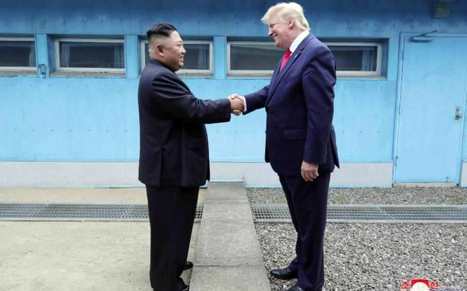 President Donald Trump greets North Korean leader Kim Jong Un at the border between the two Koreas, June 30, 2019. 