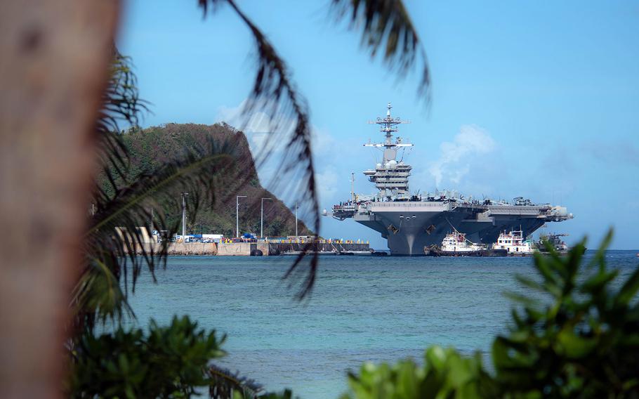 The aircraft carrier USS Theodore Roosevelt prepares to moor on Guam on Feb. 7, 2019.