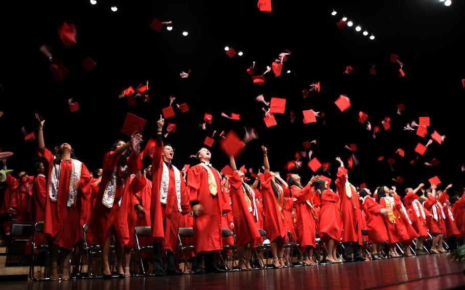 Seniors from Nile C. Kinnick High School celebrate during their graduation ceremony at Yokosuka Naval Base, Japan, June 8, 2018.