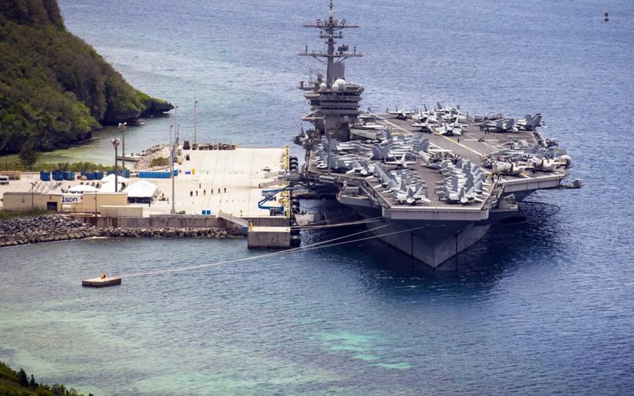 The aircraft carrier USS Theodore Roosevelt is moored at Naval Base Guam, Friday, May 15, 2020.