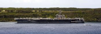 The aircraft carrier USS Theodore Roosevelt is moored at Naval Base Guam, Friday, May 15, 2020.