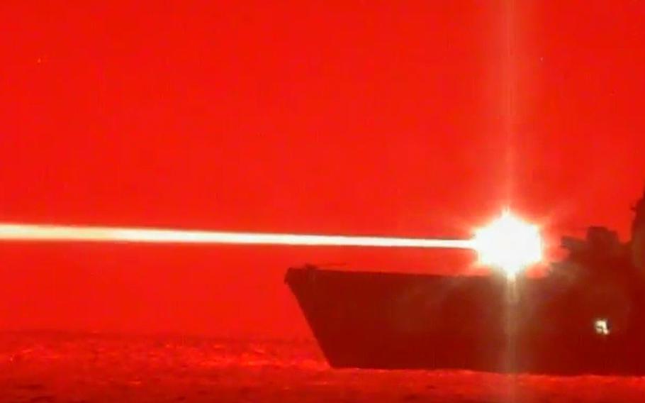 The USS Portland uses a high-energy laser weapon system known as an LWSD to shoot down an unmanned aerial vehicle somewhere in the Pacific on May 16, 2020.