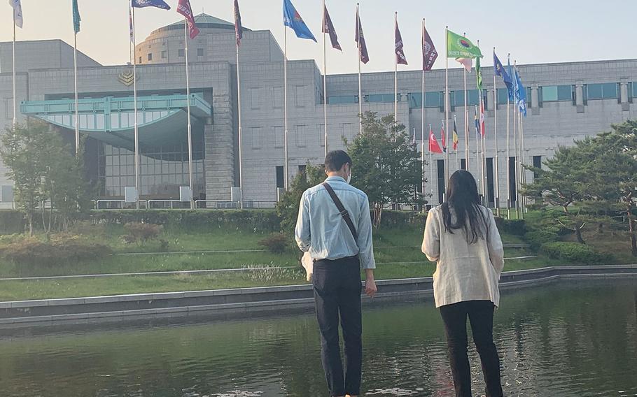 A couple walks near the War Memorial of Korea museum in Seoul, South Korea, on Thursday, May 28.
