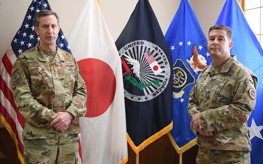 U.S. Forces Japan commander Lt. Gen. Kevin Schneider, left, and senior enlisted leader Chief Master Sgt. Rick Winegardner Jr. discuss the command's health-protection level in a video posted to Facebook, Friday, June 12, 2020. 