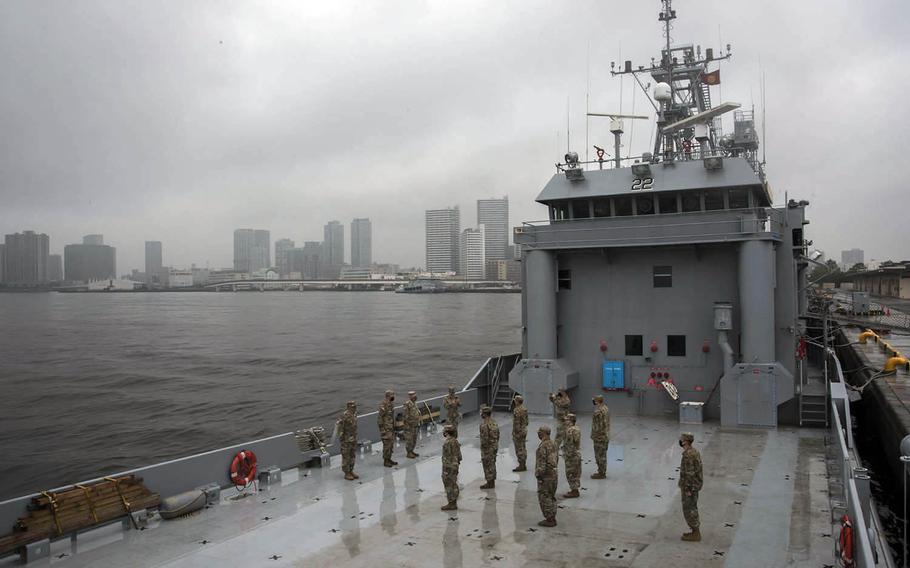 Soldiers take part in a promotion ceremony and celebrate the Army's 245th birthday aboard the Army Vessel Harpers Ferry at Yokohama North Dock, Japan, Sunday, June 14, 2020.