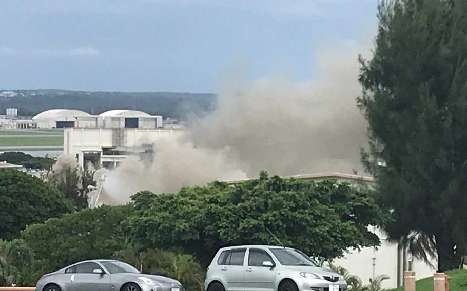 Smoke rises from a fire that started at a hazardous materials building at Kadena Air Base, Japan, Monday,  June 22, 2020.