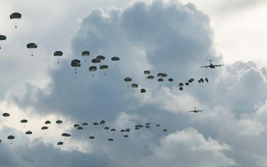 Hundreds of paratroopers assigned to U.S. Army Alaska jump onto Andersen Air Force Base, Guam, Tuesday, June 30, 2020.