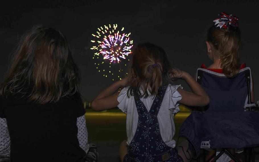 Children watch a fireworks show at Yokota Air Base, the home of U.S. Forces Japan in western Tokyo, Thursday, July 2, 2020. 