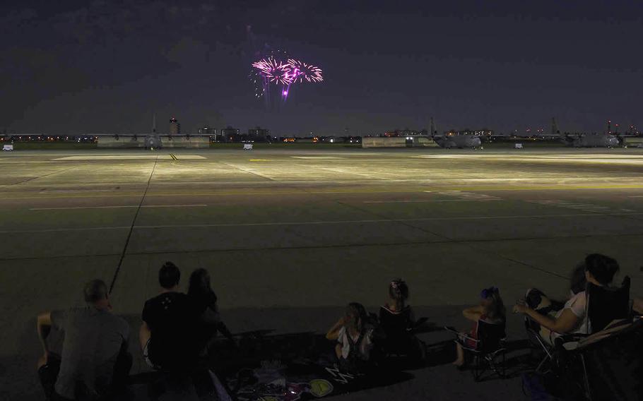 Families watch a fireworks show at Yokota Air Base in western Tokyo, Thursday, July 2, 2020. 