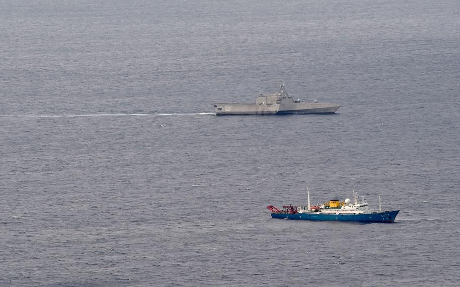 The littoral combat ship USS Gabrielle Giffords conducts routine operations in the vicinity of the Chinese vessel Hai Yang Di Zhi 4 Hao, shown in the foreground, in the South China Sea July 1, 2020.