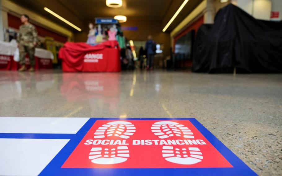 A social distancing decal is posted outside the exchange at Camp Humphreys, South Korea, March 27, 2020.