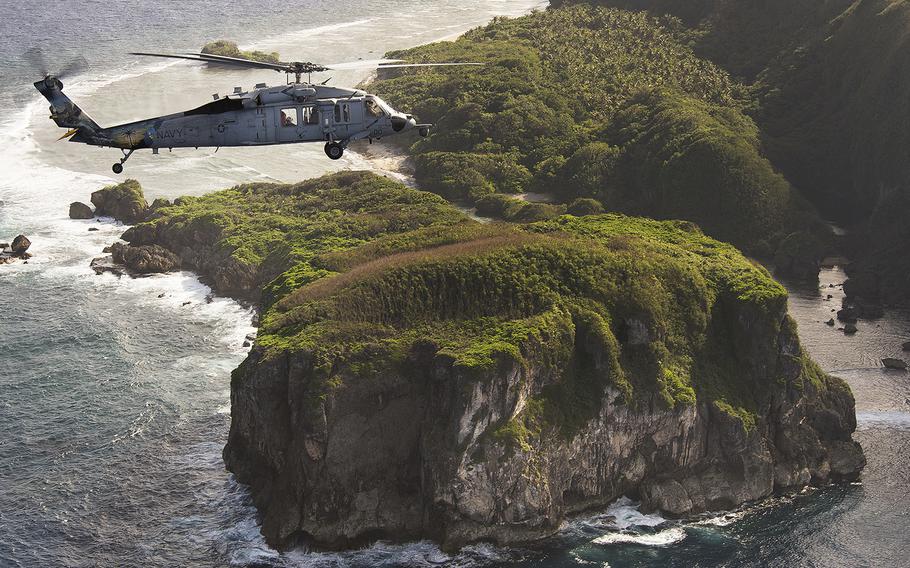 An MH-60S Seahawk assigned to Helicopter Sea Combat Squadron 25 flies off off the coast of Guam in December 2015. 