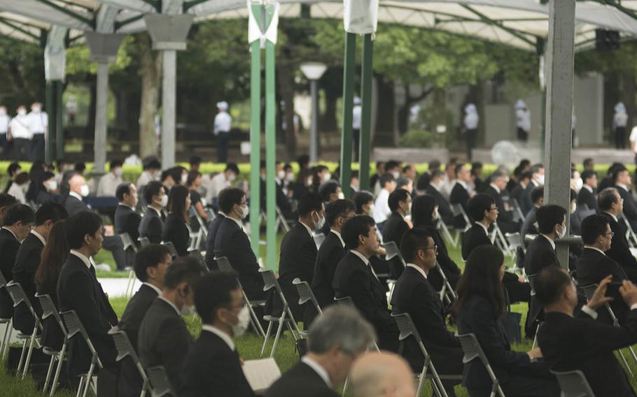 People gather at Hiroshima Peace Memorial Park, Thursday, Aug. 6, 2020, to mark the atomic bombing's 75th anniversary.