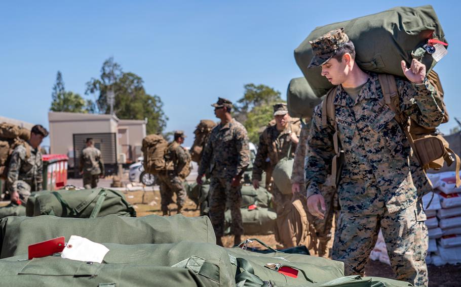 Marines head for their new living areas at Royal Australian Air Force Base Darwin after completing a two-week quarantine in the Northern Territory of Australia, July 22, 2020. 
