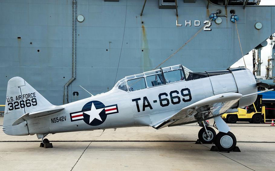 A North American T-6 Texan stands on a dock at Joint Base Pearl Harbor-Hickam in Hawaii after being offloaded from the USS Essex on Aug. 11, 2020. 