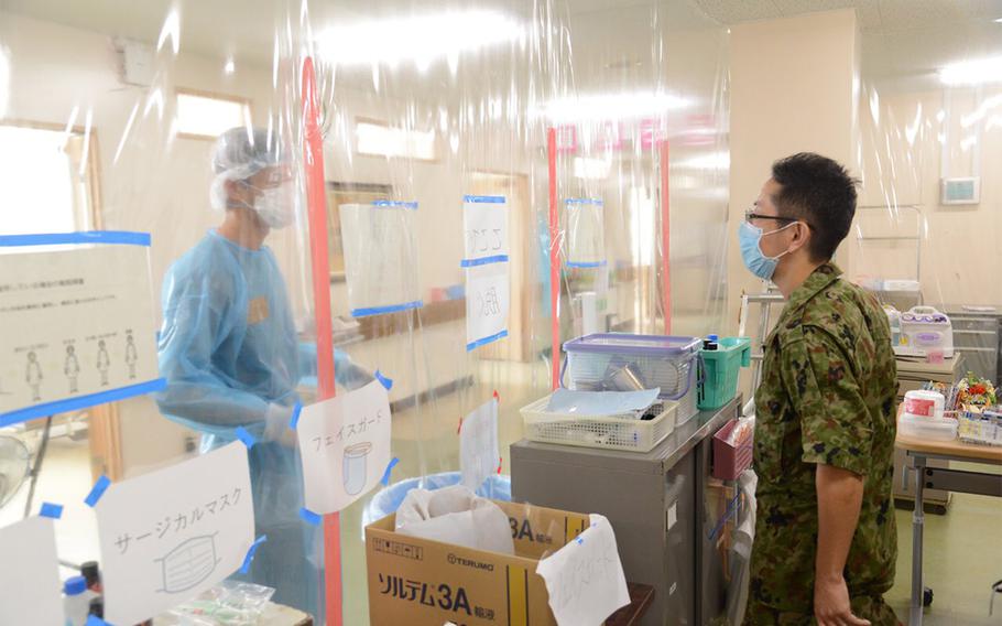 Members of a Japan Ground Self-Defense Force medical battalion support coronavirus patients at an unidentified hospital on Okinawa, Aug. 19, 2020. 