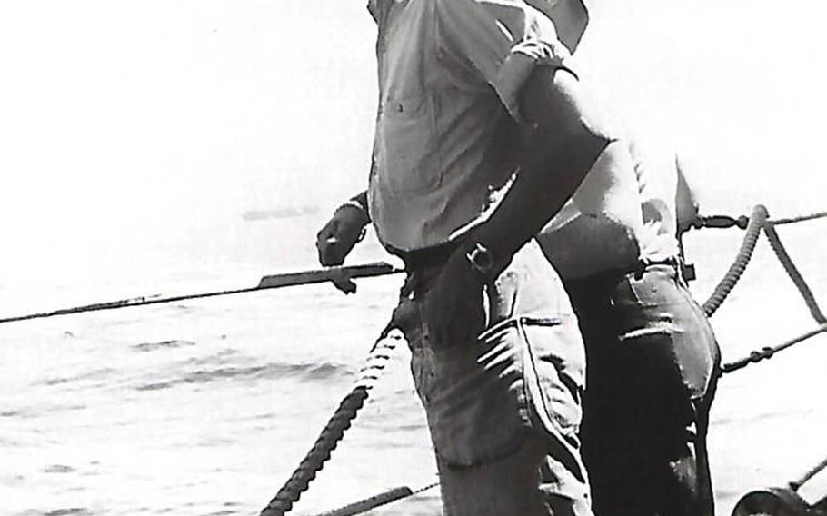 Donald Fosburg stands on a ship's deck in this undated photo taken during World War II. 