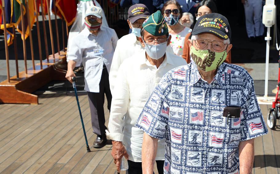 World War II veterans walk to the fantail of the battleship Missouri on Sept. 2, 2020, for a commemoration of the 75th anniversary of the end of the war. 