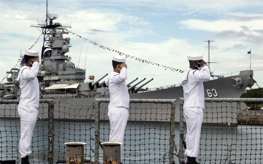 Sailors aboard the guided-missile destroyer USS Michael Murphy render honors to the Battleship Missouri Memorial in Pearl Harbor, Hawaii, during a ceremony Sept. 2, 2020, for the 75th commemoration of the end of World War II.