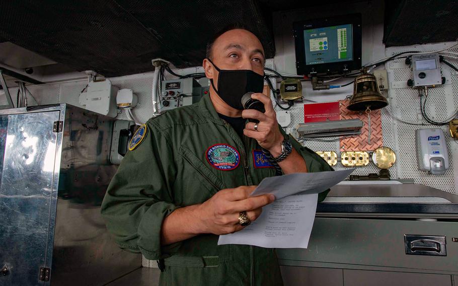 Capt. Fred Goldhammer, commanding officer of the aircraft carrier USS Ronald Reagan, addresses his crew during a change-of-command ceremony in the pilot house Oct. 1, 202.