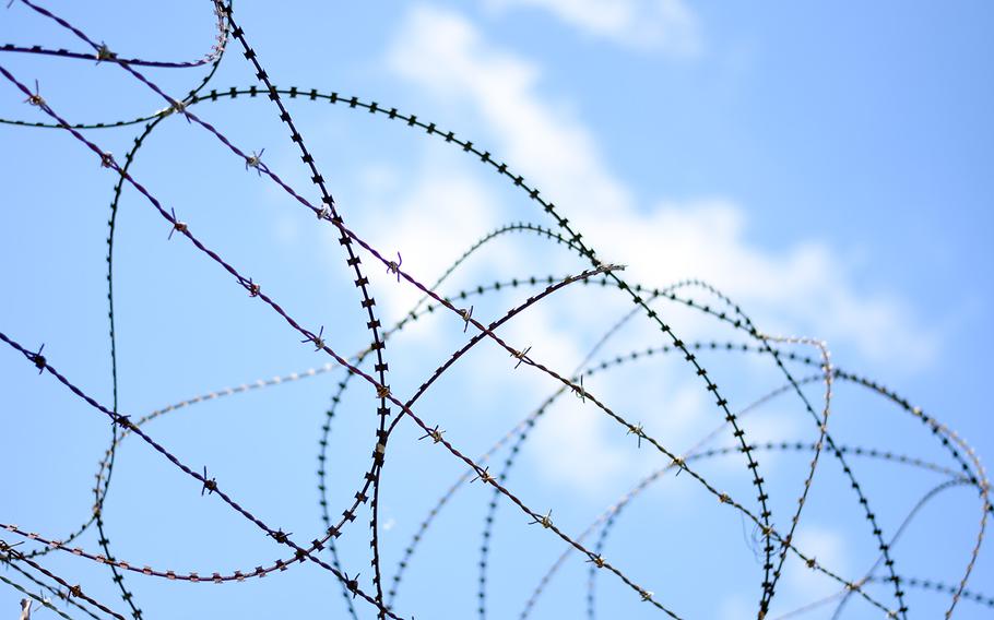 Concertina and barbed wire top a fence near the Demilitarized Zone between North and South Korea. 