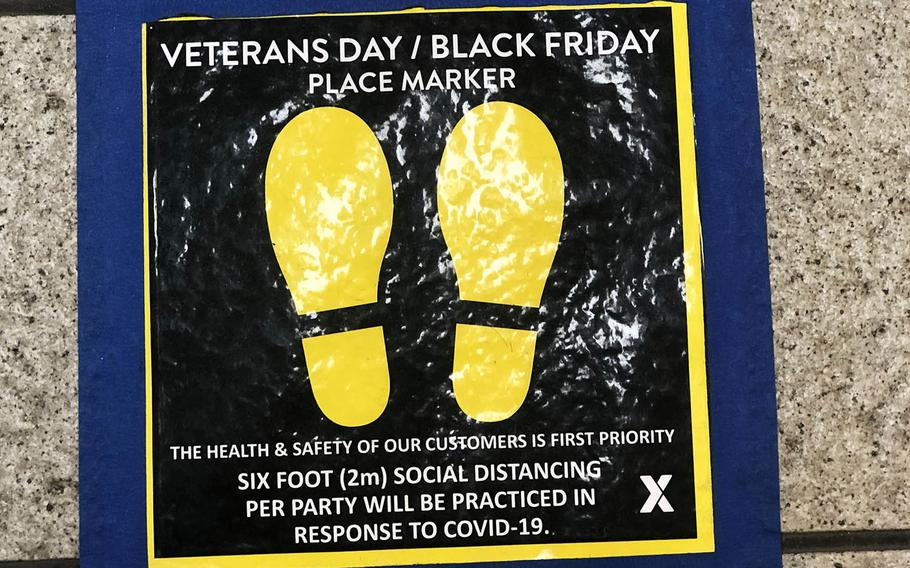 A floor decal reminds exchange patrons at Yokota Air Base in western Tokyo to practice social distancing during Black Friday shopping.