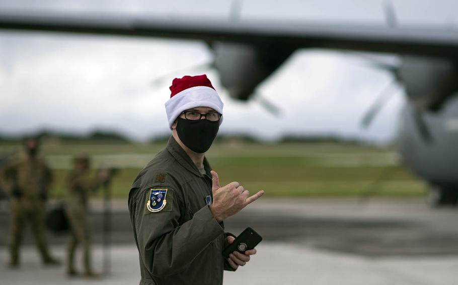 Maj. Joseph Spitz, a 36th Airlift Squadron pilot participating in Operation Christmas Drop, poses in a Santa hat at Andersen Air Force Base, Guam, Dec. 2, 2020.