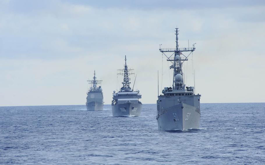 The guided-missile frigate USS Taylor leads Navy and Japan Maritime Self-Defense Force ships participating in a passing exercise in 2011. 