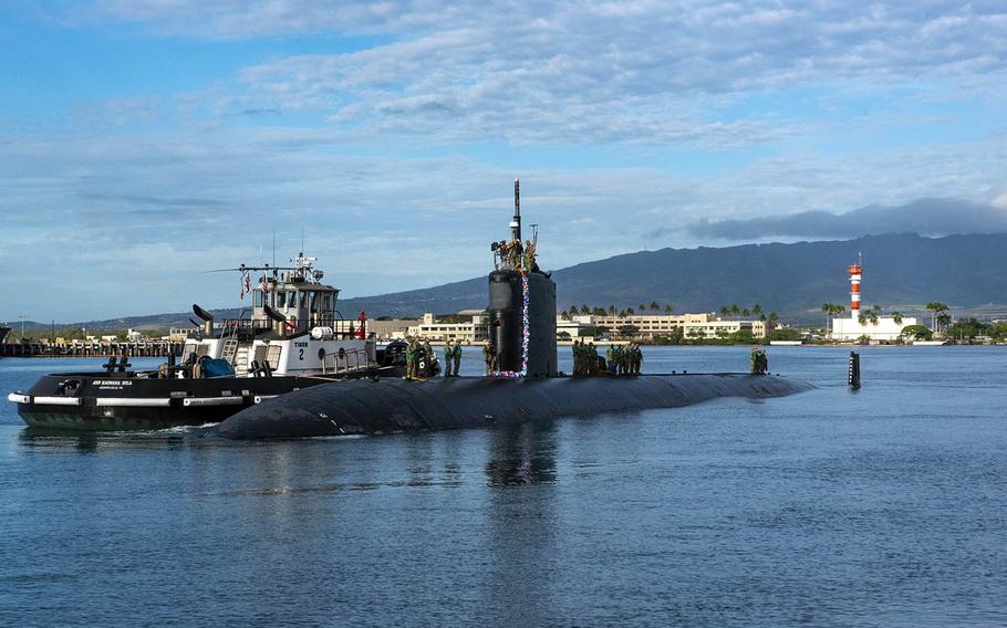 The Los Angeles-class fast-attack submarine USS Topeka arrives in Pearl Harbor, Hawaii, after completing a change of homeport from Guam, Dec. 15, 2020.