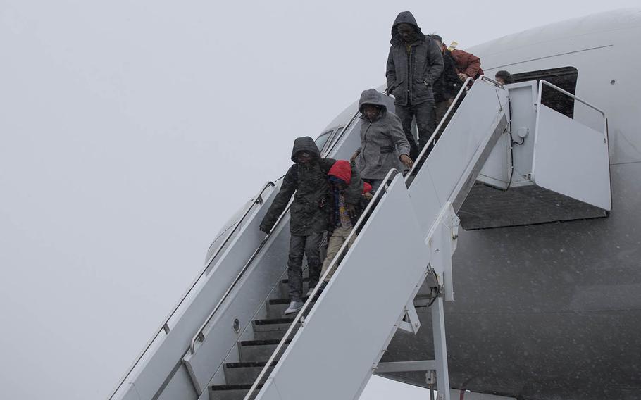 Patriot Express passengers exit their flight after landing at Misawa Air Base, Japan, in 2017. 