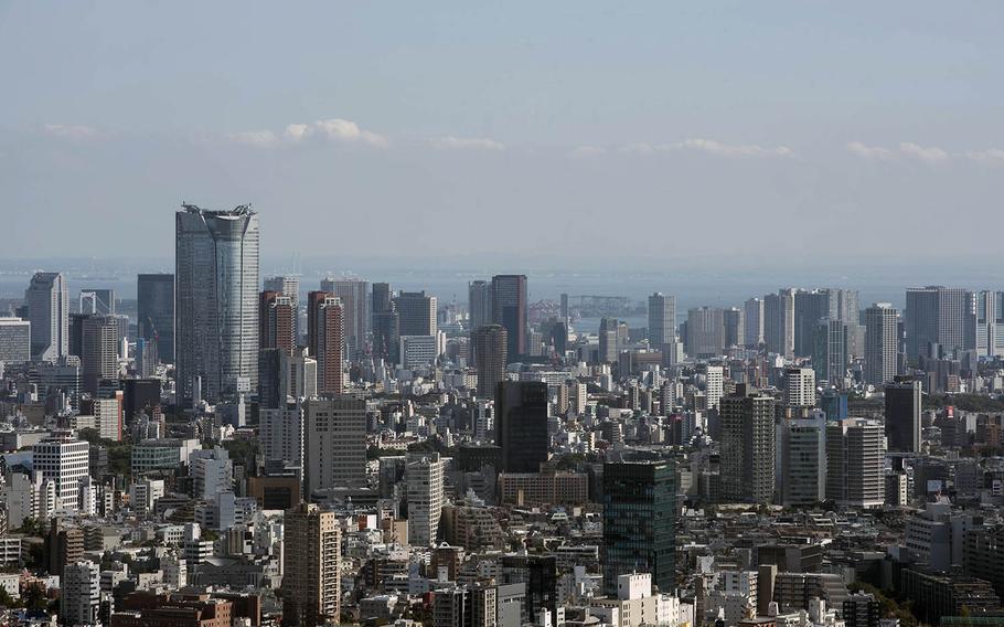 Tokyo, a city of 13.5 million, within two days during the week of Dec. 13, 2020, hit its highest and second highest daily totals for new coronavirus infections.  