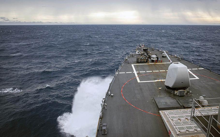 The destroyer USS John S. McCain passes through the South China Sea on a freedom-of-navigation patrol on Tuesday, Dec. 22, 2020.