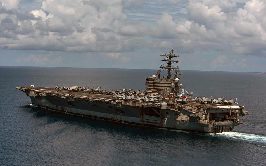 Coronavirus forced some of its crew to quarantine aboard the aircraft carrier USS Ronald Reagan,  shown here in July 2019, at its homeport, Yokosuka Naval Base, Japan, for the December 2020 holidays. 