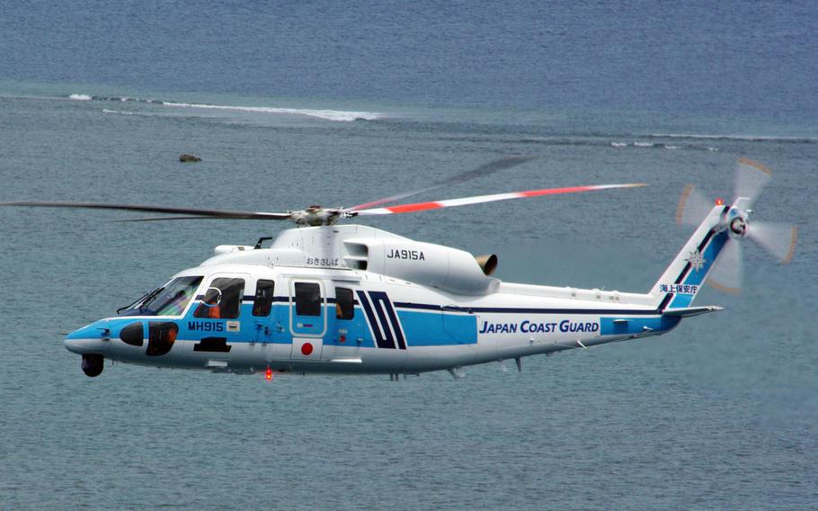 A Japan Coast Guard MH-915 helicopter, like this one in an undated photo, took part in a two-day search for a missing U.S. Navy civilian employee starting Dec. 15, 2020.